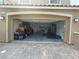 Open two-car garage with an epoxy floor and ample storage space, offering convenient parking at 8105 Switchback Run St, Las Vegas, NV 89166