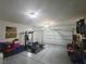 Spacious garage featuring epoxy flooring, ample lighting, and plenty of room for storage at 8105 Switchback Run St, Las Vegas, NV 89166