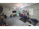 Organized garage space featuring epoxy flooring, abundant storage, and a dedicated workout area at 8105 Switchback Run St, Las Vegas, NV 89166
