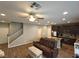 Open concept living space featuring wood floors and a ceiling fan at 8105 Switchback Run St, Las Vegas, NV 89166
