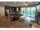 Cozy living room showcasing a sliding glass door to a backyard at 8105 Switchback Run St, Las Vegas, NV 89166
