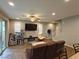 Open-concept living room with neutral walls, modern furnishings, and a sliding glass door at 8105 Switchback Run St, Las Vegas, NV 89166