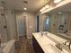 Dual sinks and walk-in shower featured in the bathroom at 8105 Switchback Run St, Las Vegas, NV 89166