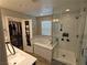 Modern primary bathroom with separate shower, tub, and walk-in closet at 8105 Switchback Run St, Las Vegas, NV 89166