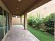 Charming covered patio with stylish pavers, perfect for outdoor entertaining with a tranquil garden area at 8105 Switchback Run St, Las Vegas, NV 89166
