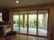 Backyard patio with sliding glass doors, brick pavers and low maintenance landscaping at 8105 Switchback Run St, Las Vegas, NV 89166
