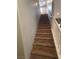 Carpeted stairway with white railing provides access to the upper level at 8105 Switchback Run St, Las Vegas, NV 89166
