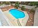 Backyard featuring a sparkling pool and landscaped area, ideal for outdoor enjoyment at 8305 Woodland Prairie Ave, Las Vegas, NV 89129