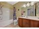 Bathroom with a shower-tub combo, single vanity, and neutral tile flooring at 8324 W Charleston Blvd # 2053, Las Vegas, NV 89117