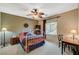 Cozy bedroom featuring a decorative ceiling fan and a comfortable wrought iron bed frame at 8324 W Charleston Blvd # 2053, Las Vegas, NV 89117