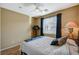 Bedroom with wood floors, ceiling fan, and bright natural light at 8324 W Charleston Blvd # 2053, Las Vegas, NV 89117