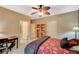 Bedroom featuring neutral walls, carpet, and a wrought iron bed frame and ceiling fan at 8324 W Charleston Blvd # 2053, Las Vegas, NV 89117