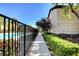 Beautiful community pool with manicured landscaping, a walkway and nearby building at 8324 W Charleston Blvd # 2053, Las Vegas, NV 89117