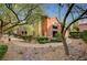 Attractive exterior view of a building with well-maintained landscaping and winding walkways at 8324 W Charleston Blvd # 2053, Las Vegas, NV 89117