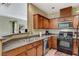Modern kitchen with stainless steel appliances and pass-through to living space at 8324 W Charleston Blvd # 2053, Las Vegas, NV 89117