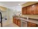 Galley kitchen with stainless steel appliances and tile flooring at 8324 W Charleston Blvd # 2053, Las Vegas, NV 89117