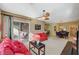 Comfortable living room area with plush sofas, ceiling fan, and screened-in patio at 8324 W Charleston Blvd # 2053, Las Vegas, NV 89117