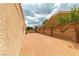 Gravel-covered backyard area with block wall, providing a low-maintenance and private outdoor space at 8346 Christinas Cove Ave, Las Vegas, NV 89131