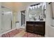 Modern bathroom featuring a glass shower, dark wood vanity, and stylish fixtures at 8346 Christinas Cove Ave, Las Vegas, NV 89131