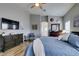 Comfortable main bedroom featuring hardwood floors, a ceiling fan, and stylish decor at 8346 Christinas Cove Ave, Las Vegas, NV 89131