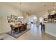 Bright dining area with neutral tones, tile floors, chandelier and access to kitchen and backyard at 8346 Christinas Cove Ave, Las Vegas, NV 89131
