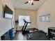 A versatile exercise room including a television and workout machine at 8346 Christinas Cove Ave, Las Vegas, NV 89131
