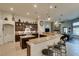 Spacious kitchen with granite countertops, an island, dark wood cabinets, and stainless steel appliances at 8346 Christinas Cove Ave, Las Vegas, NV 89131