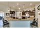 Stylish kitchen with granite countertops, stainless steel appliances, and bar seating at 8346 Christinas Cove Ave, Las Vegas, NV 89131