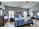 Relaxing main bedroom boasting stylish decor, warm lighting, and hardwood floors at 8346 Christinas Cove Ave, Las Vegas, NV 89131