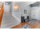 Entryway featuring stairs, light gray walls, and hardwood floors at 8817 Adobe Grande St, Las Vegas, NV 89131