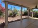 The covered patio offers a serene view of the landscaped backyard, enhancing outdoor living at 8872 Perfect Diamond Ct, Las Vegas, NV 89129