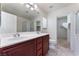 Bathroom featuring double sinks, and a glass enclosed shower at 8872 Perfect Diamond Ct, Las Vegas, NV 89129
