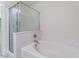 Bright bathroom featuring a soaking tub and glass-enclosed shower at 8872 Perfect Diamond Ct, Las Vegas, NV 89129