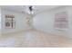 Sunlit bedroom with tile floors and a ceiling fan at 8872 Perfect Diamond Ct, Las Vegas, NV 89129