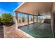 Covered patio with ceiling fan overlooking a landscaped backyard at 8872 Perfect Diamond Ct, Las Vegas, NV 89129