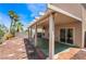 A shaded patio features a ceiling fan and access to the landscaped backyard at 8872 Perfect Diamond Ct, Las Vegas, NV 89129