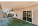 Covered patio featuring a ceiling fan and access to the backyard and sliding glass door at 8872 Perfect Diamond Ct, Las Vegas, NV 89129