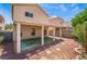 Exterior view of a covered patio, adjacent to a low maintenance backyard at 8872 Perfect Diamond Ct, Las Vegas, NV 89129