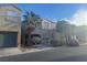 View of a two-story home with an attached garage, private balcony, and desert landscaping at 9078 Hilverson Ave, Las Vegas, NV 89148