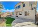 A view of backyard with desert landscaping, a basketball hoop, and patio at 9416 Highview Rock Ct, Las Vegas, NV 89149
