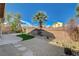 The backyard has desert landscaping, a concrete patio and a basketball hoop at 9416 Highview Rock Ct, Las Vegas, NV 89149