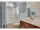 Cozy bathroom with a shower-tub combo and vanity with good lighting at 9416 Highview Rock Ct, Las Vegas, NV 89149