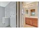 Bathroom featuring double sinks with wood cabinets and tile floor at 9416 Highview Rock Ct, Las Vegas, NV 89149