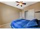 Bedroom with a ceiling fan, a good sized window, and a closet at 9416 Highview Rock Ct, Las Vegas, NV 89149