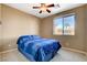Bedroom with a ceiling fan and a good sized window at 9416 Highview Rock Ct, Las Vegas, NV 89149