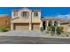Two-story home featuring a three-car garage and desert landscaping at 9416 Highview Rock Ct, Las Vegas, NV 89149