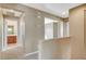 Hallway with staircase and view to a bathroom at 9416 Highview Rock Ct, Las Vegas, NV 89149