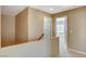 Hallway with staircase and view to a bedroom at 9416 Highview Rock Ct, Las Vegas, NV 89149
