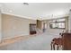 Large living room with stairway, neutral walls, and carpeted flooring at 9416 Highview Rock Ct, Las Vegas, NV 89149