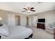 Bright main bedroom featuring a closet, neutral decor, and a comfortable sitting area at 9416 Highview Rock Ct, Las Vegas, NV 89149